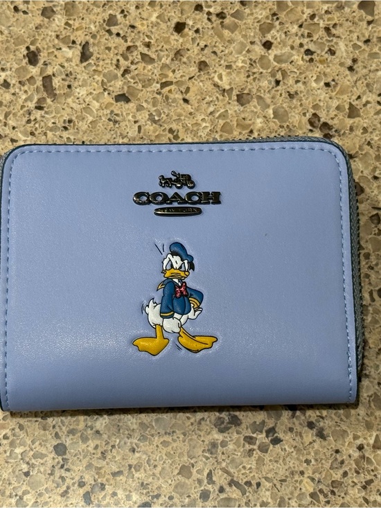 Coach Handbags - Coach Light Blue Leather Donald Duck Compact Zip Wallet